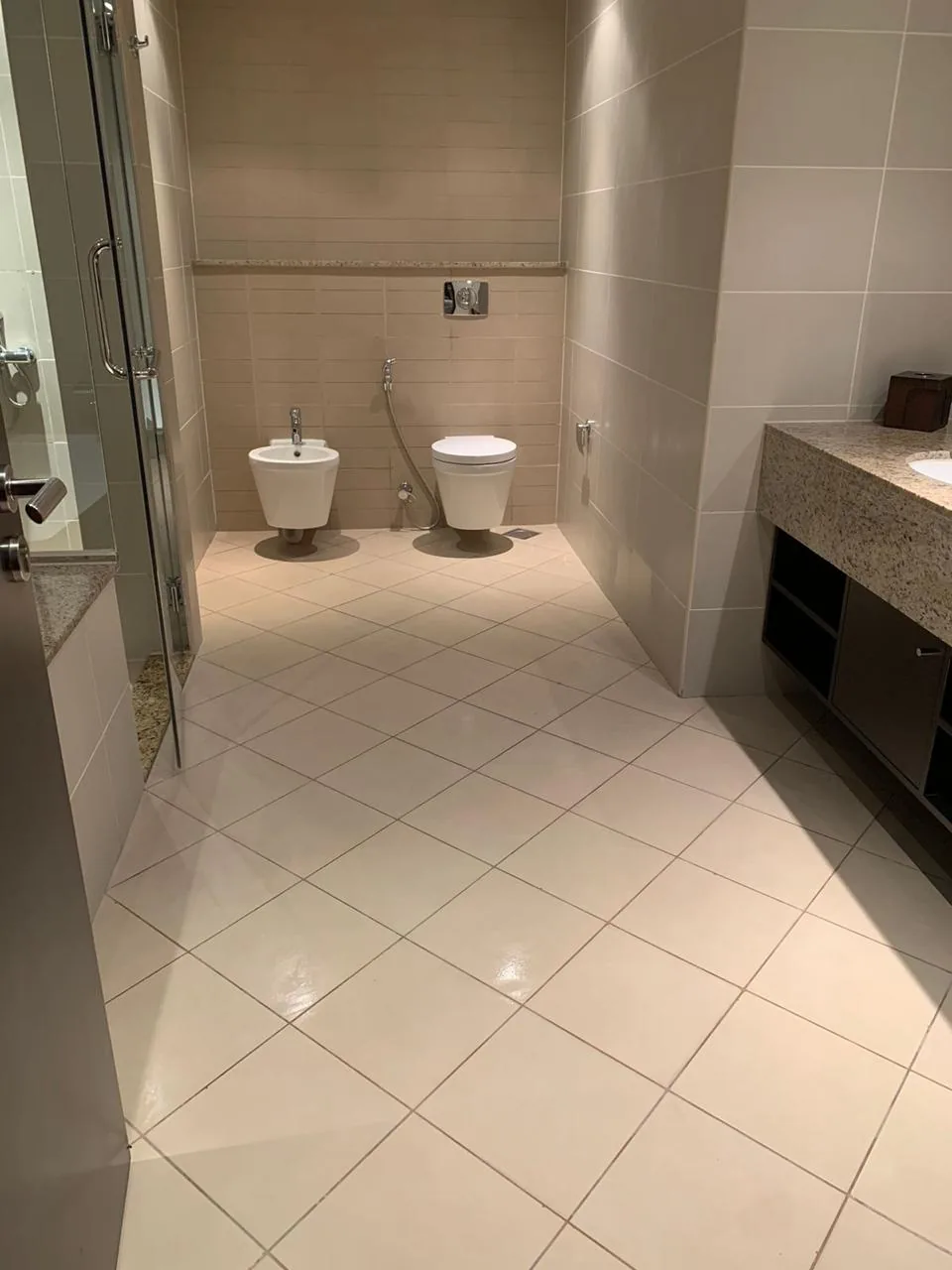 Finished bathroom with tiled floor and vanity