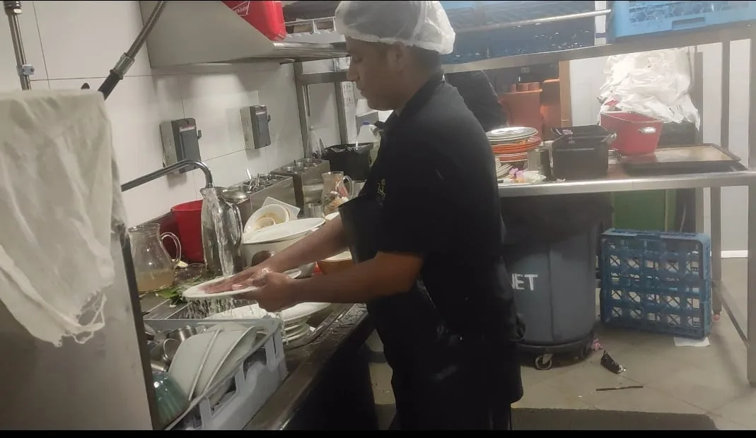 Kitchen dishwashing station in use